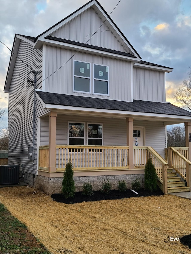 view of front facade featuring covered porch and central AC