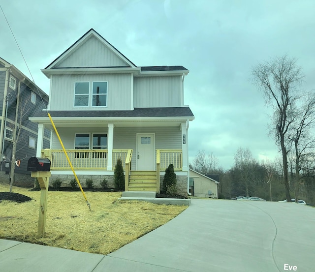 view of front of house featuring a porch and a front yard