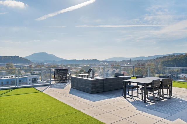 view of patio / terrace featuring a mountain view and an outdoor hangout area