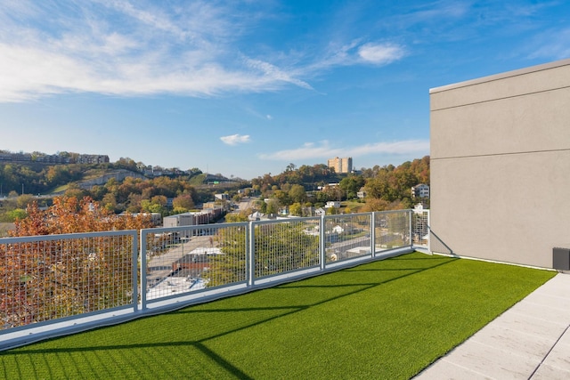 view of yard featuring a balcony