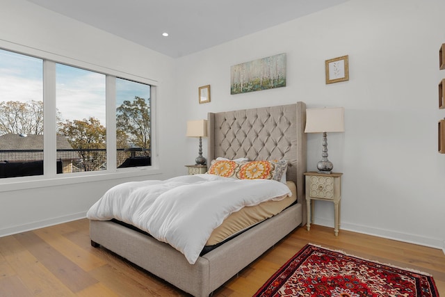 bedroom with hardwood / wood-style flooring