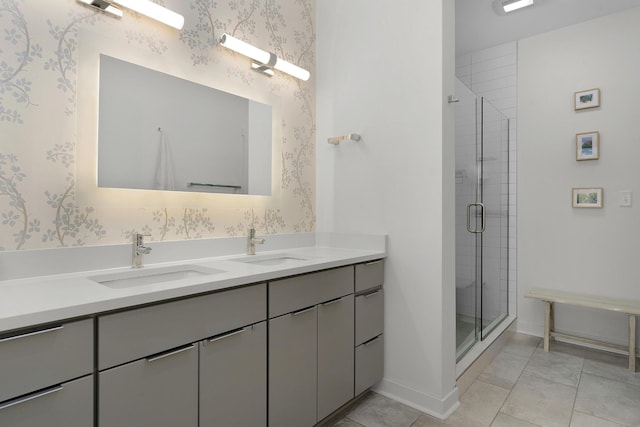 bathroom featuring tile patterned floors, vanity, and an enclosed shower