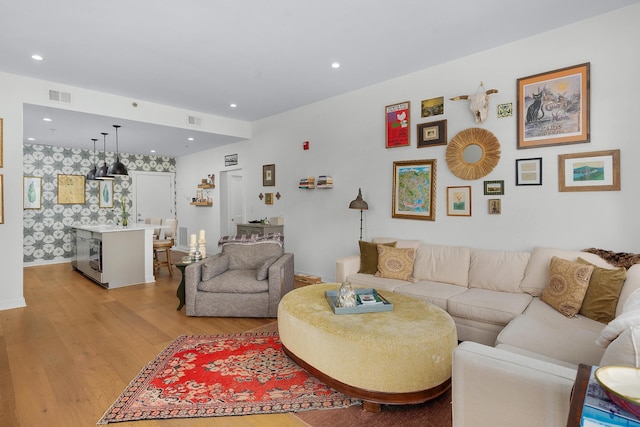 living room with light hardwood / wood-style flooring