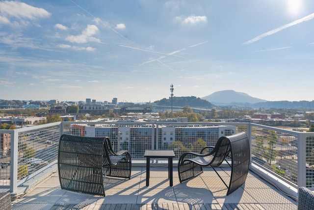 wooden deck featuring a mountain view