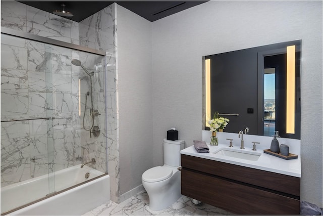 full bathroom featuring shower / bath combination with glass door, vanity, and toilet