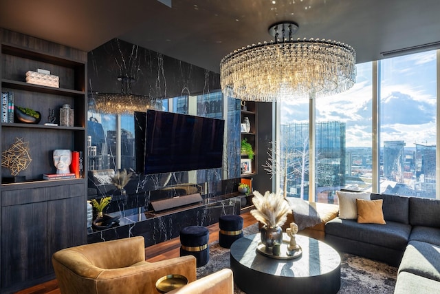 interior space featuring built in shelves, hardwood / wood-style floors, and a chandelier