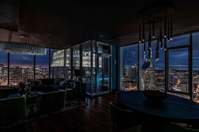 interior space with a wall of windows and hardwood / wood-style flooring