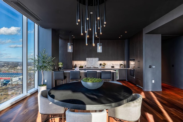 dining room with dark wood-type flooring