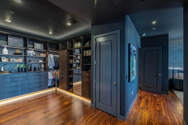 walk in closet featuring dark hardwood / wood-style floors