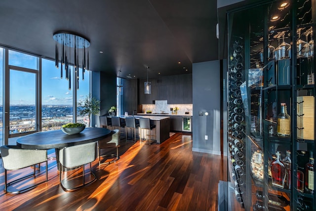 dining space with wood-type flooring