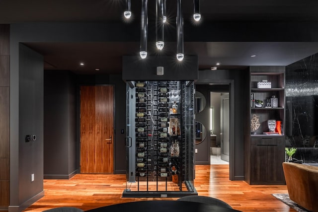 wine room featuring light wood-type flooring