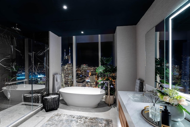 bathroom with a tub and vanity