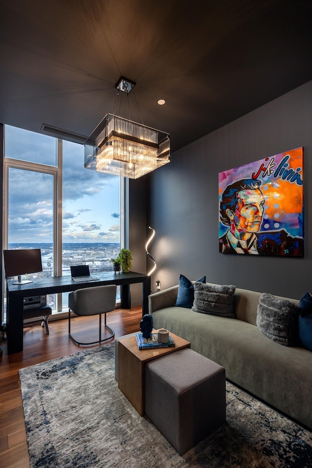 interior space with hardwood / wood-style floors and an inviting chandelier