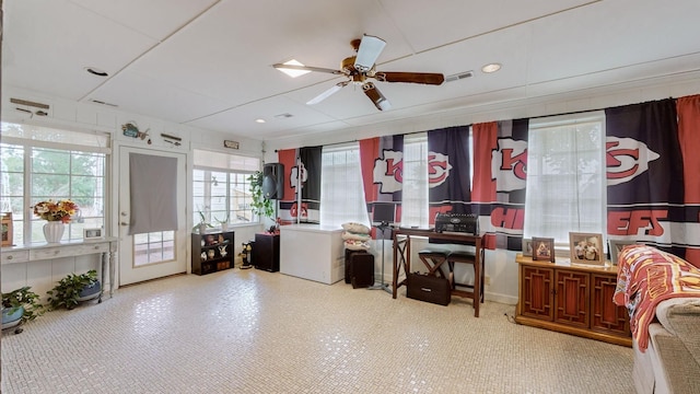 interior space with ceiling fan and plenty of natural light