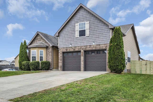 view of front of home featuring a garage and a front lawn