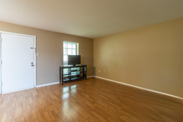 unfurnished living room with hardwood / wood-style floors