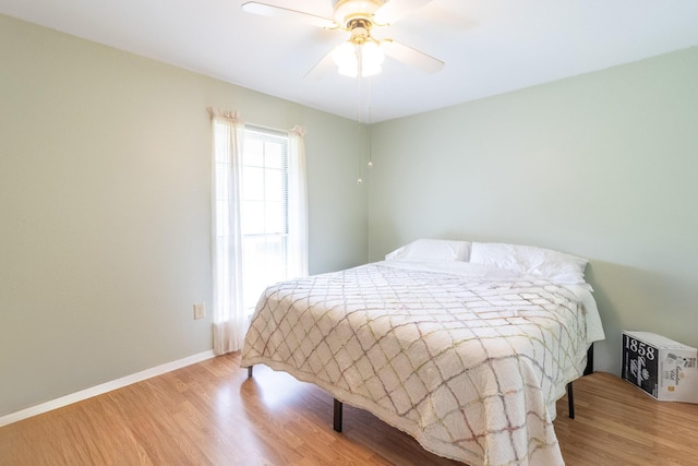 bedroom with light wood-type flooring and ceiling fan