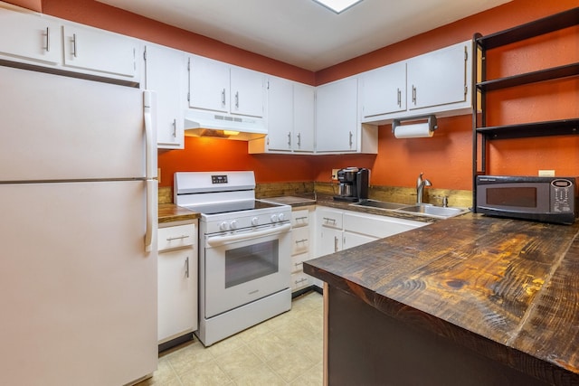 kitchen featuring sink, white cabinets, white appliances, and wood counters