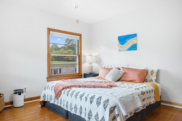 bedroom featuring wood-type flooring