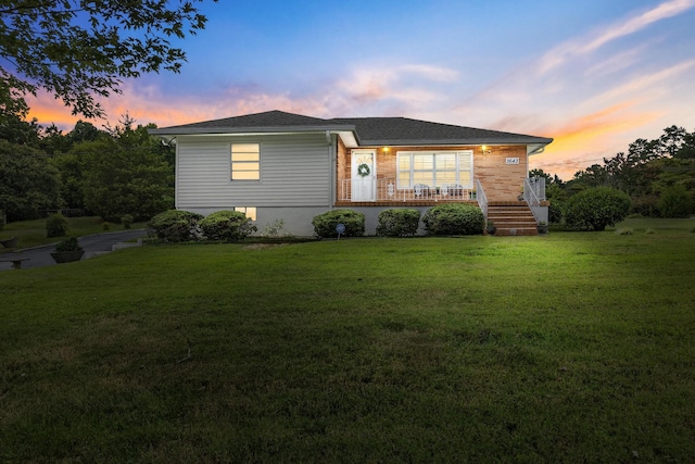 view of front of house with a yard