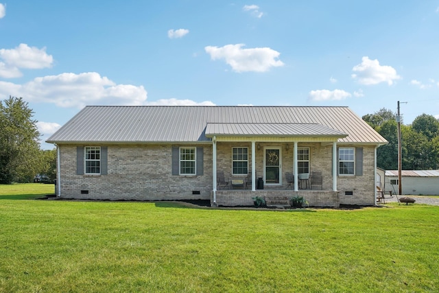 back of property featuring a porch and a lawn