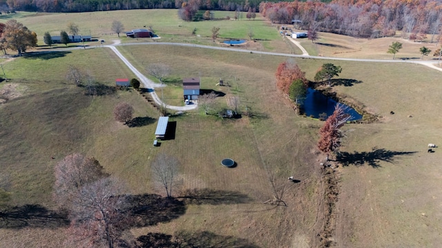 birds eye view of property with a rural view and a water view