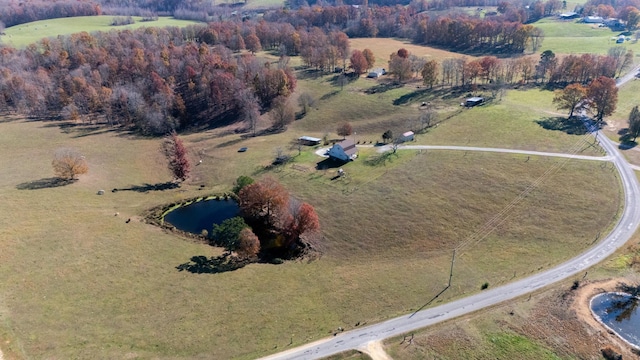 birds eye view of property featuring a rural view and a water view