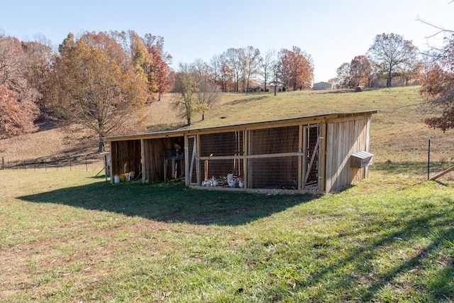 exterior space with a lawn and a rural view