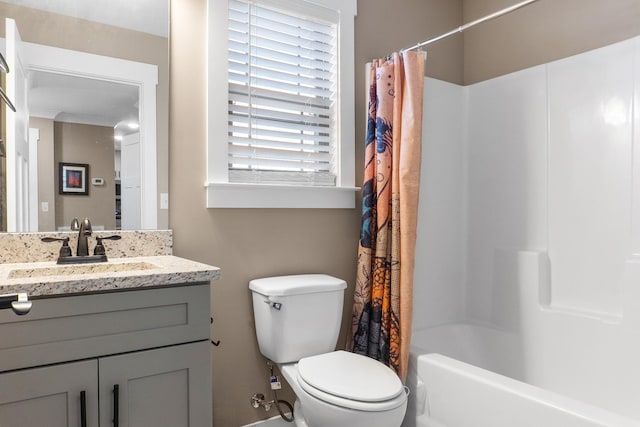 full bathroom with vanity, shower / bath combo, toilet, and crown molding