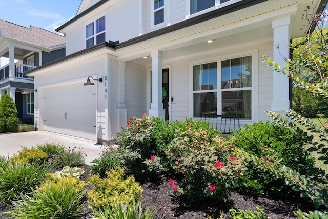 doorway to property with a garage