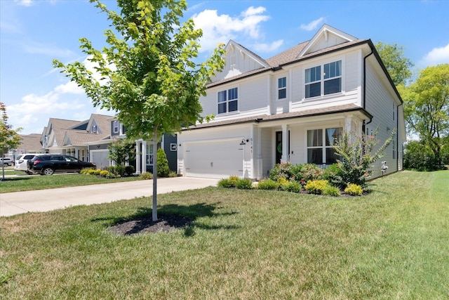 view of front of property featuring a garage and a front lawn