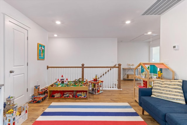 recreation room featuring hardwood / wood-style flooring