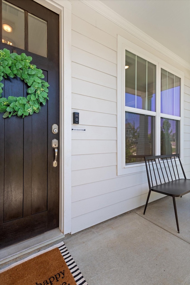 doorway to property featuring a porch