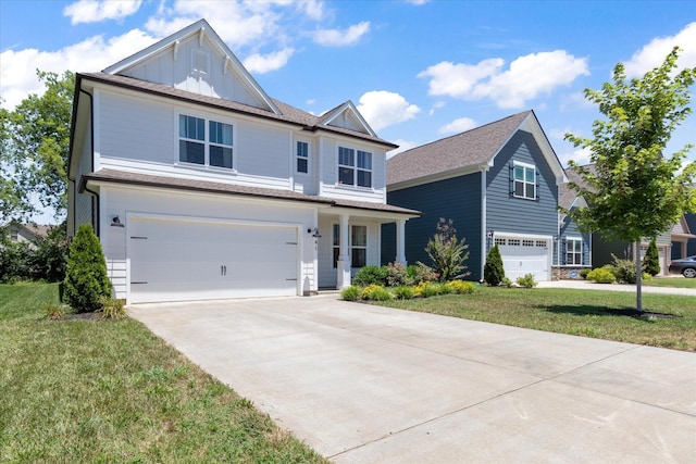 view of front property featuring a garage and a front lawn