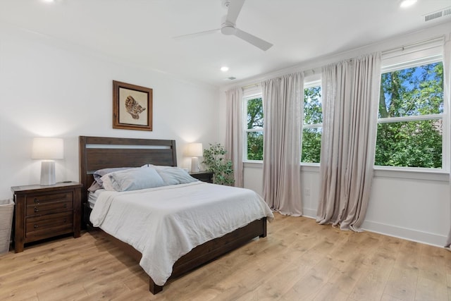 bedroom featuring light wood-type flooring and ceiling fan