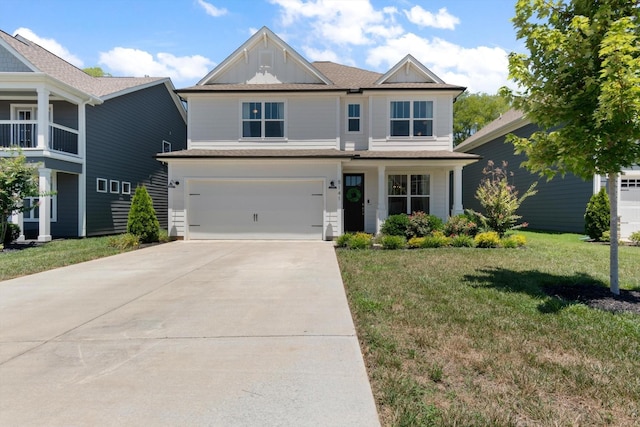 craftsman house with a front lawn and a garage