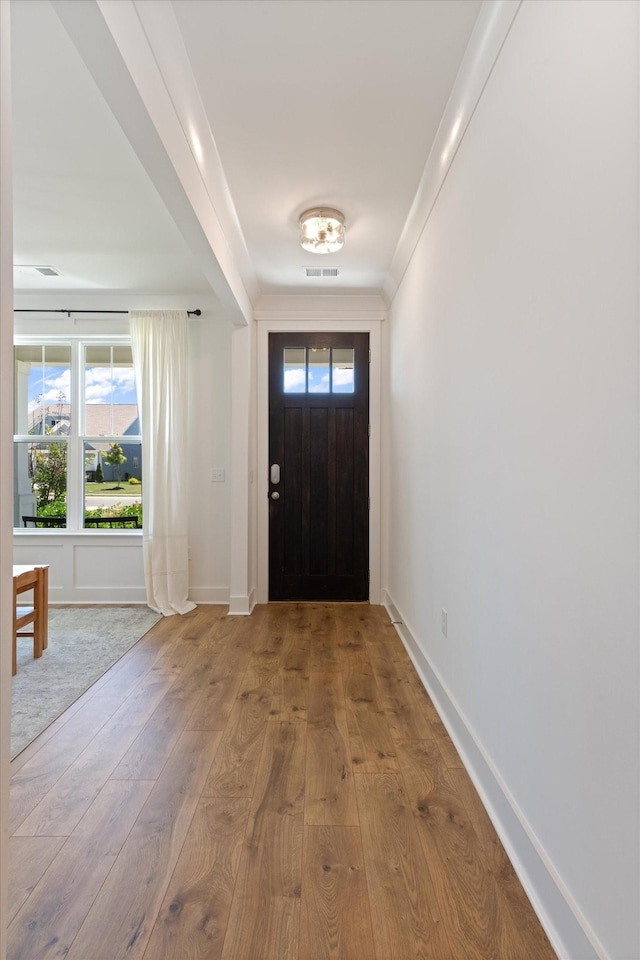 foyer entrance with light hardwood / wood-style floors