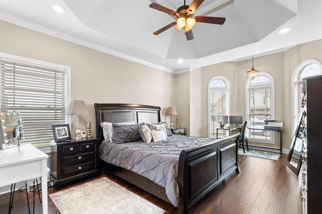 bedroom with dark wood-type flooring, recessed lighting, a raised ceiling, and baseboards