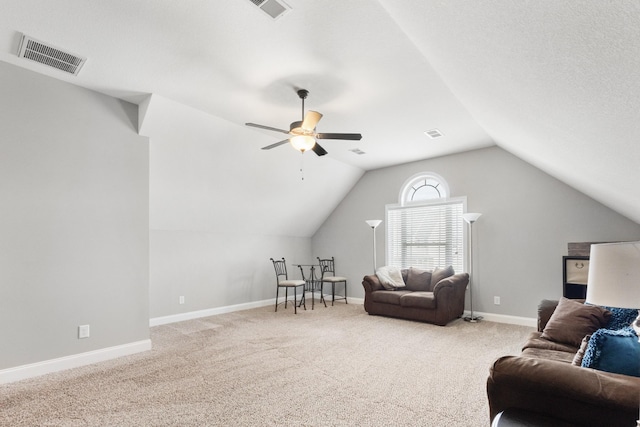 living room with carpet floors, visible vents, vaulted ceiling, and baseboards