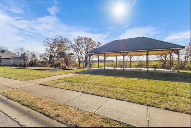 view of home's community featuring a yard, playground community, and a gazebo