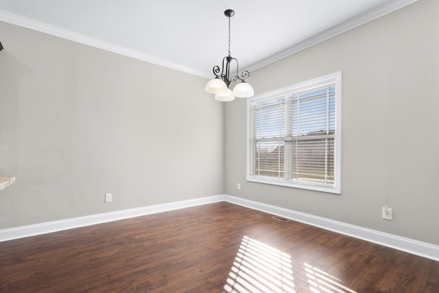 unfurnished room with visible vents, baseboards, dark wood finished floors, ornamental molding, and a notable chandelier