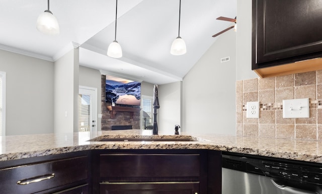 kitchen with dark brown cabinetry, light stone countertops, a sink, stainless steel dishwasher, and decorative backsplash