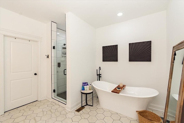 bathroom featuring tile patterned floors and independent shower and bath