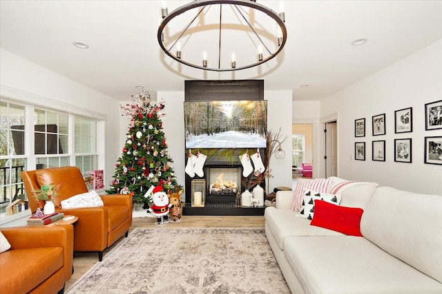 living room featuring light hardwood / wood-style floors and a notable chandelier