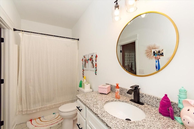 bathroom featuring tile patterned flooring, vanity, toilet, and walk in shower