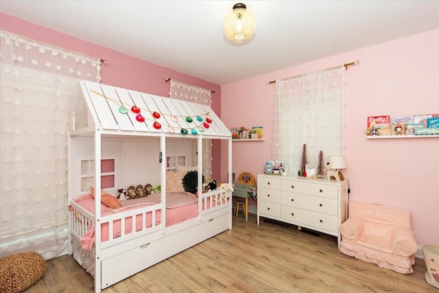 bedroom featuring hardwood / wood-style floors