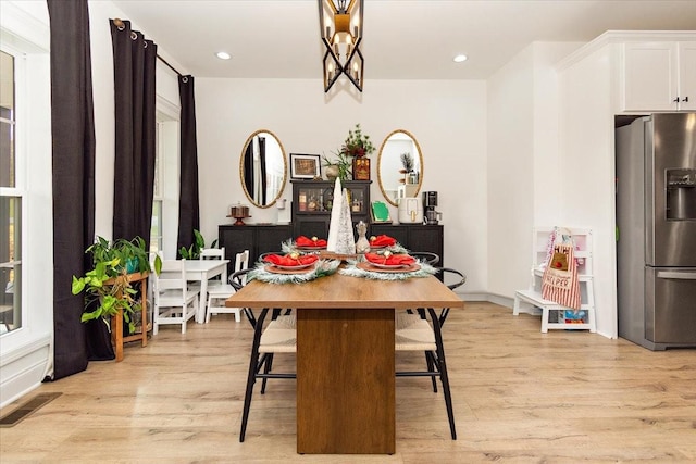 dining room with light hardwood / wood-style floors