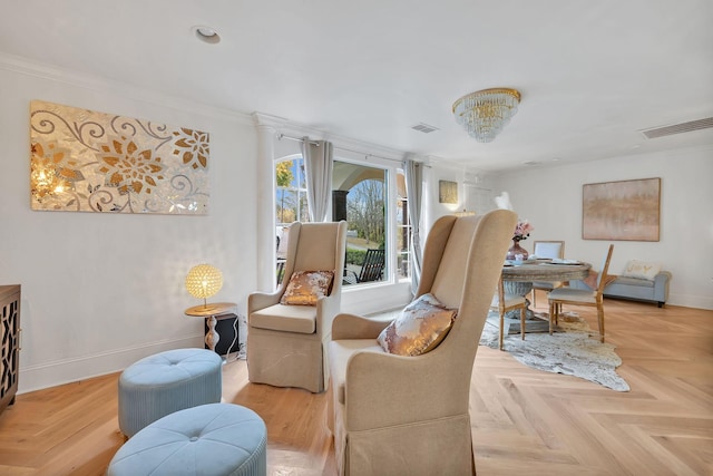 sitting room featuring crown molding and light parquet floors