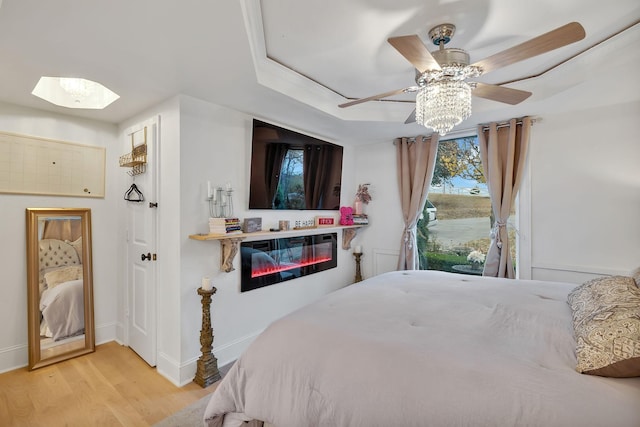 bedroom with ceiling fan and light hardwood / wood-style flooring