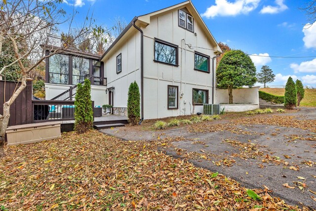 view of side of property featuring central AC unit